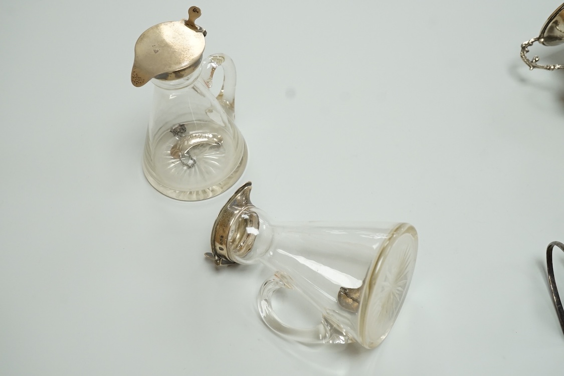 A pair of Edwardian silver mounted whisky noggins by J & J Maxfield Ltd, Birmingham, 1908, one damaged and a pair of matching silver 'Whisky' wine labels, together with a pair of late Victorian silver posy vases by Willi